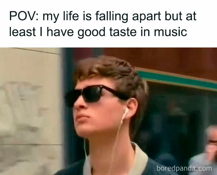 Young person wearing sunglasses and earphones with caption about life falling apart and good taste in music, relatable neurodivergent meme.