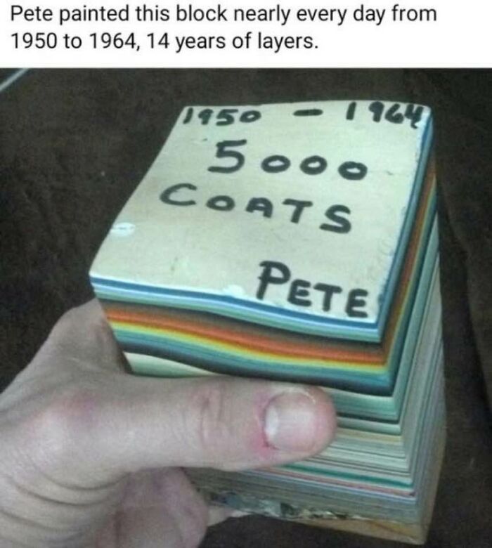 Hand holding a painted block with 5000 coats from 1950 to 1964, relatable to neurodivergent people’s attention to detail.