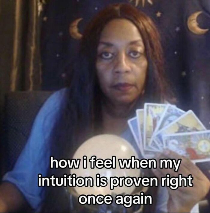Woman holding tarot cards and crystal ball with text expressing neurodivergent intuition feeling proven right in funny meme.