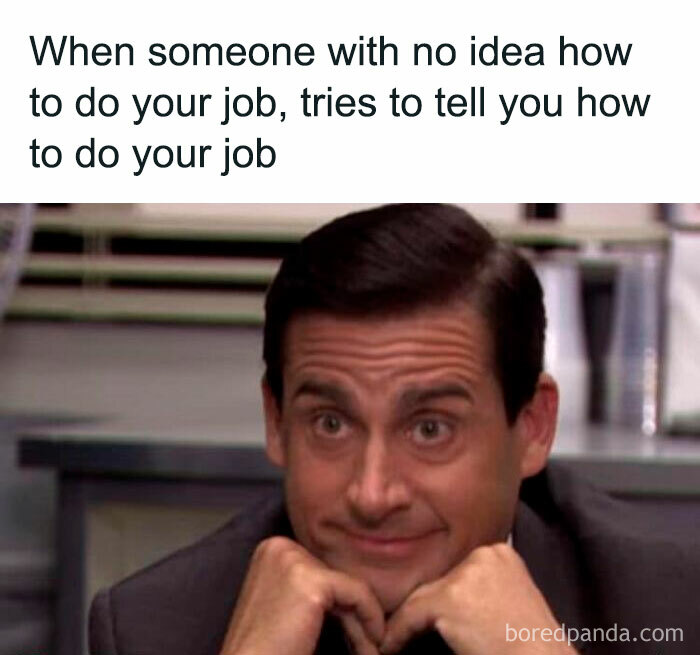 Man with skeptical expression and hands under chin representing work memes about job frustration and clueless coworkers.