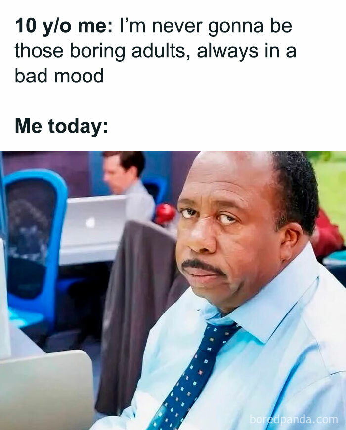 Man in office with tired expression illustrating work memes about adult frustration and mood changes at work.