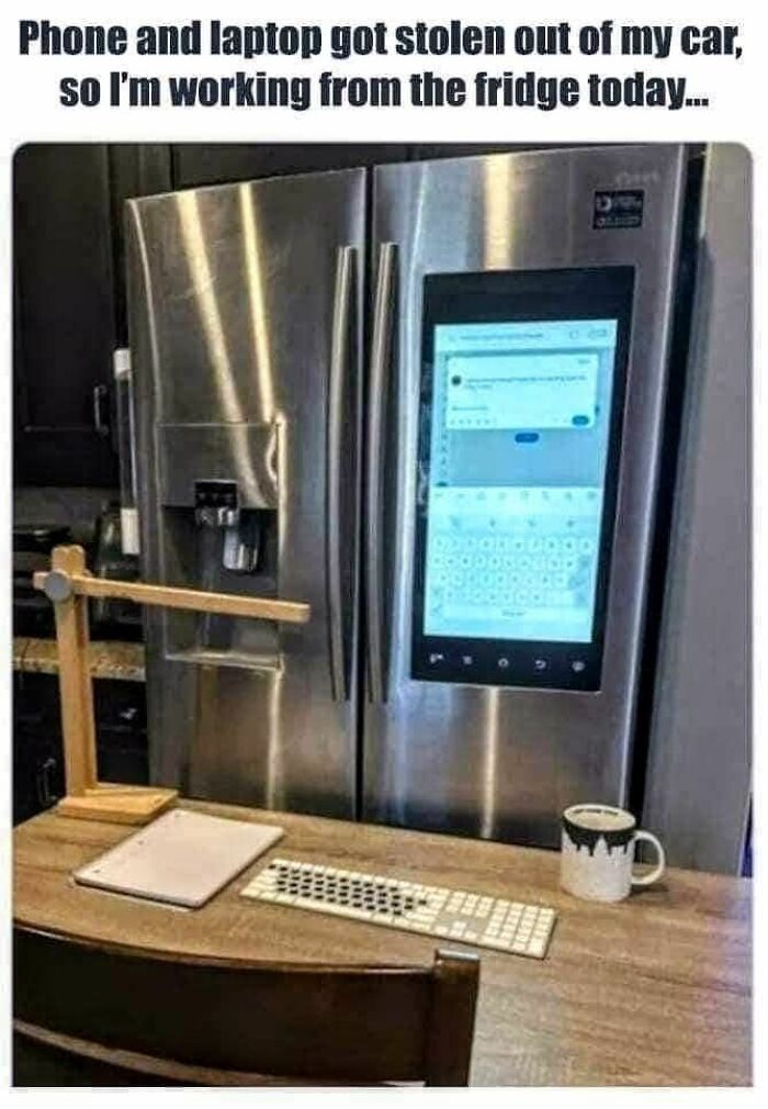 Work meme showing a person working from a kitchen fridge screen after phone and laptop were stolen.