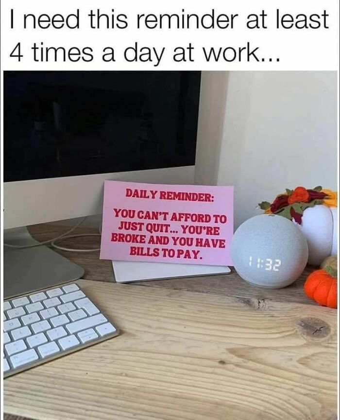 Work meme showing a daily reminder note on a desk about bills and quitting, with computer and keyboard nearby.