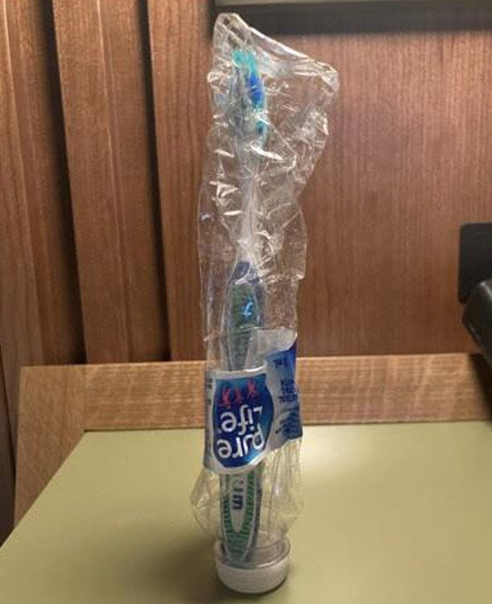 Toothbrush stored inside a toothpaste tube as a genius life hack for easy travel and hygiene protection.