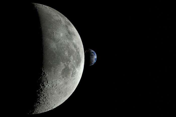 A close-up of the moon with Earth visible in the distance, illustrating space and celestial bodies.