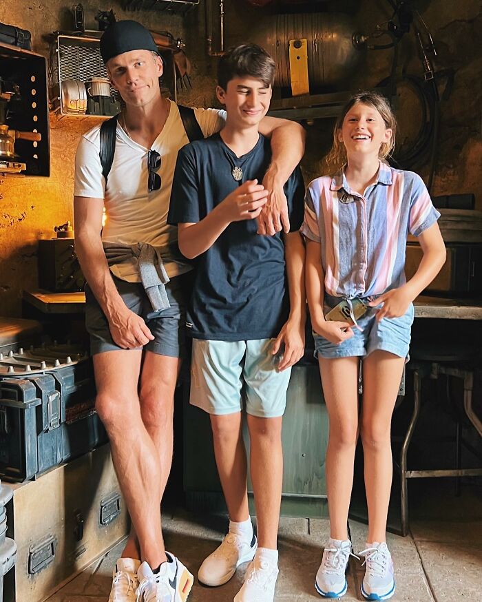Tom Brady with children smiling indoors, highlighting family moments amid Gisele B&uuml;ndchen parenting tensions.
