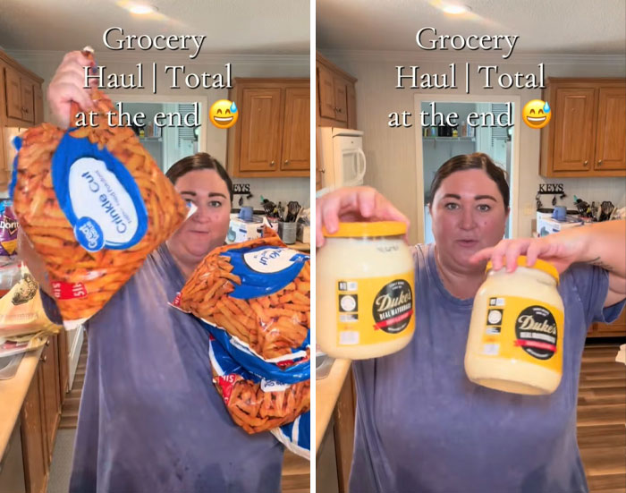 Woman in kitchen holding bags of snack chips and jars, showcasing an American family grocery haul in a home setting.