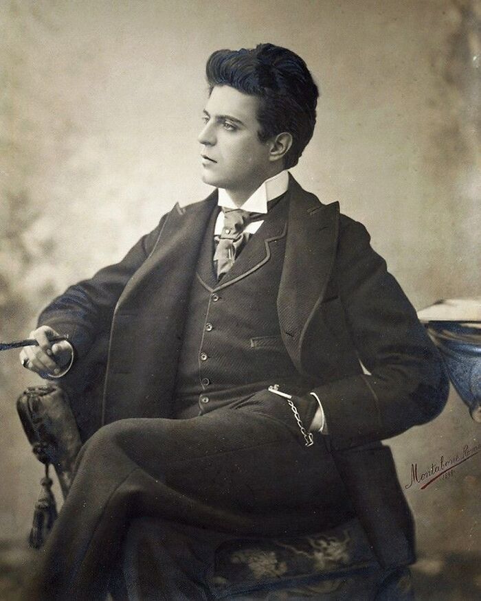 Victorian man dressed in formal suit seated with confident pose, embodying the charm of handsome Victorian men.