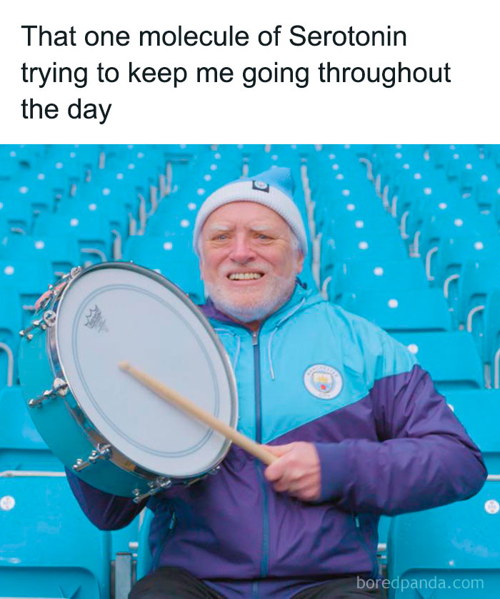 Older man in a blue jacket and hat playing a drum, humorously representing serotonin in funny medical memes.