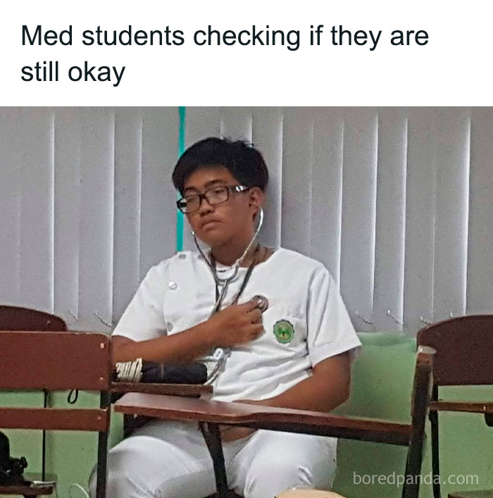 Medical student using stethoscope in classroom, humorously representing relatable medical memes for next checkup.