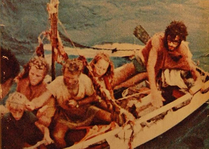 Group of people in a small boat on water, illustrating unbelievable historical events that people actually survived.