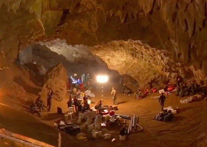 Rescue team working inside a cave during a historical event where people survived an unbelievable ordeal.