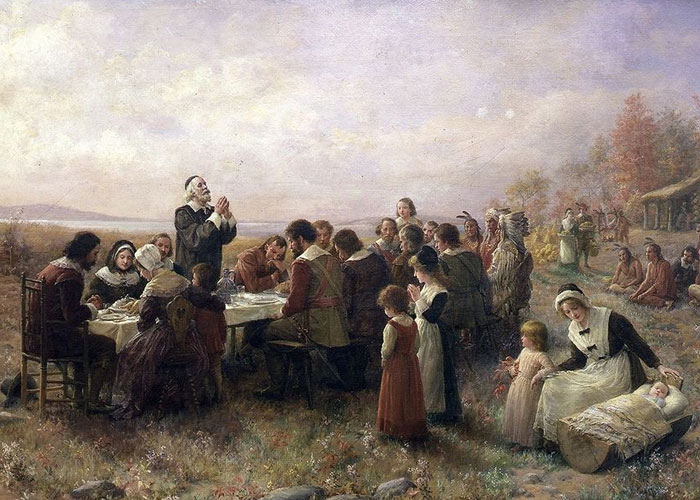 Pilgrims gathered outdoors for a historic meal, representing unbelievable historical events that people actually survived.