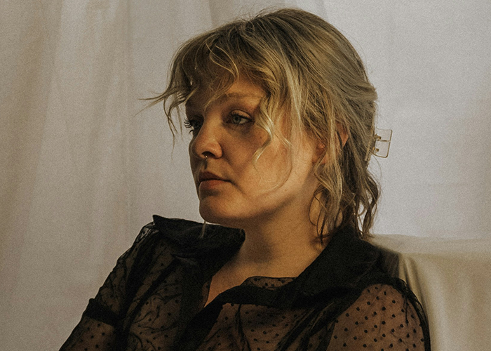 Woman looking thoughtful and upset, capturing emotions of a life turned upside down after husband's confession of love.