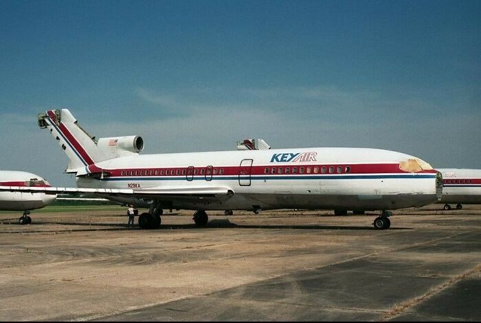 Abandoned airplane on a runway representing one of the world's most baffling unsolved mysteries in aviation history.