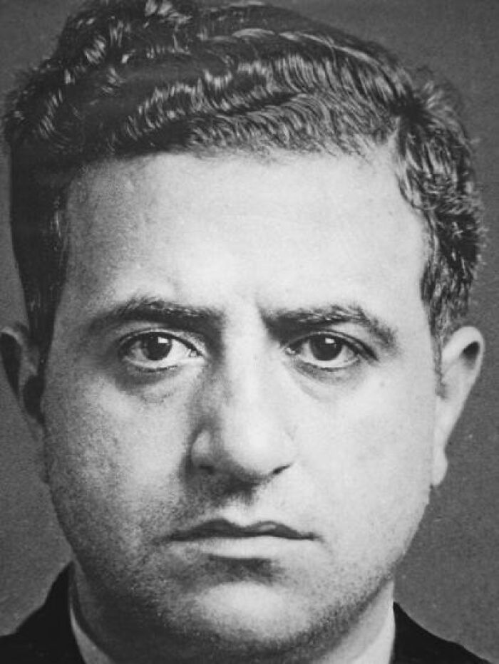 Black and white close-up portrait of a notorious mob boss, one of the most infamous figures in mob boss history.