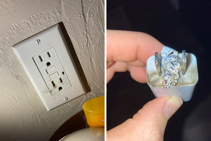 Electrical outlet with a device held by hand showing a foil-wrapped object, illustrating sibling shenanigans and mishaps.