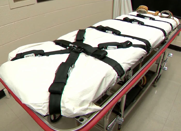 Execution gurney with restraints in sterile room related to inmate cries during painful execution and defibrillator issues. - 4