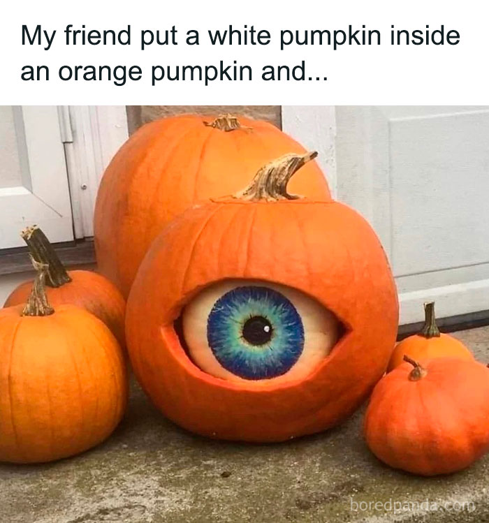 Pumpkin crafted with a white pumpkin inside an orange one creating a realistic eyeball, showcasing ingenious crafty ideas.