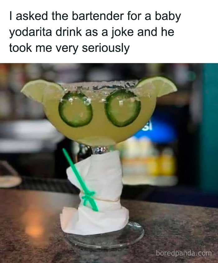 Cocktail creatively garnished with lime and cucumber slices shaped like Yoda ears, showcasing ingenious crafty ideas.