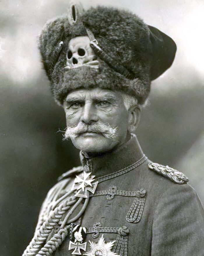 Historic black and white portrait of a military officer wearing a distinctive fur hat with a skull emblem, showcasing unfamiliar parts of history.