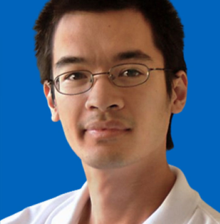 Man wearing glasses and a white shirt against blue background, representing people sharing new facts learned with others.
