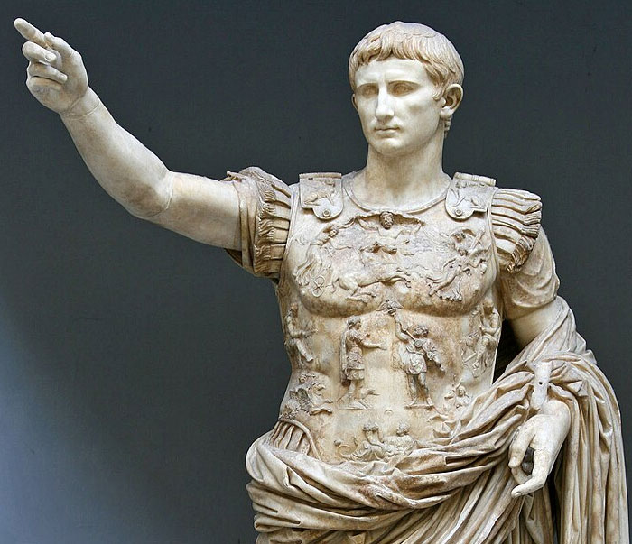 Marble statue of a Roman figure in armor with an outstretched arm, illustrating history new facts shared by people.