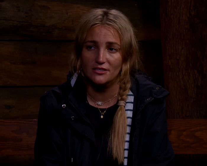 Young woman with blonde braided hair wearing a black jacket, sharing her experience about Jamie Lynn Spears' daughter accident coma.