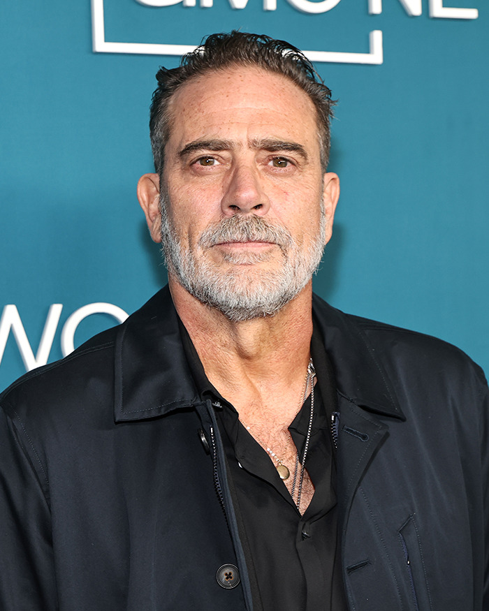 Jeffrey Dean Morgan at event, responding to viral theory about personal habits, wearing black jacket over black shirt.