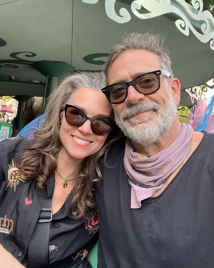 Jeffrey Dean Morgan wearing sunglasses and smiling with a woman, responding to viral theory about his personal life.