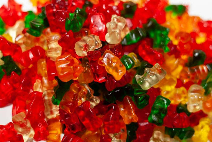 Close-up of colorful gummy bears representing unusual and strange money-making hacks people have actually pulled off.