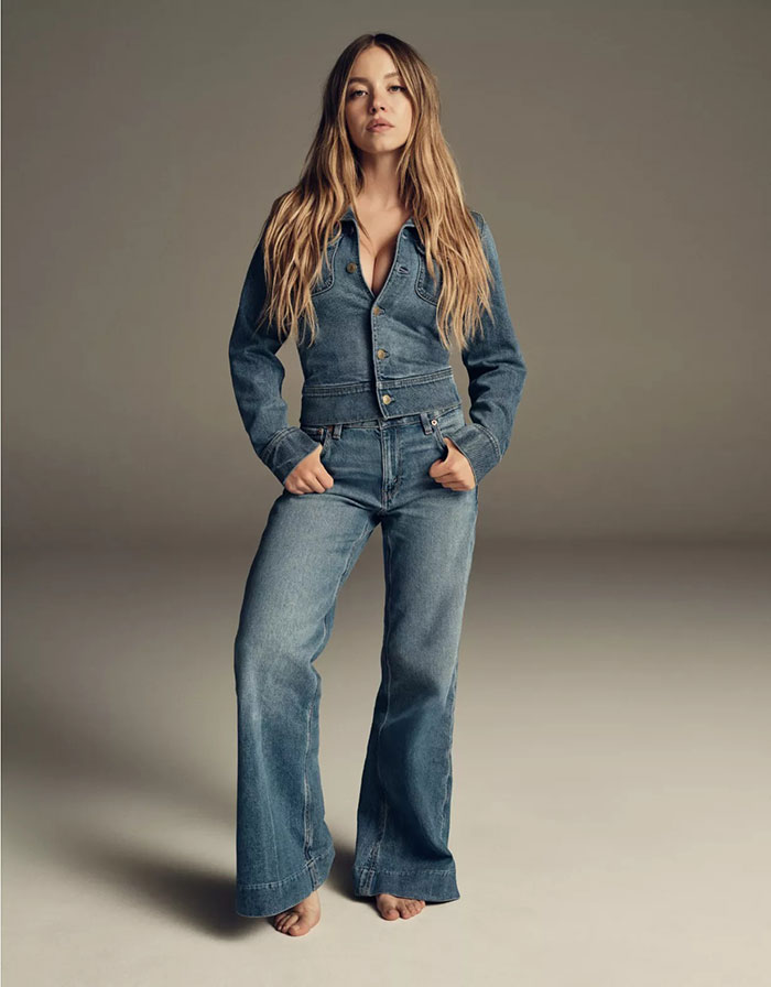Woman wearing a denim jacket and wide-leg jeans in a Gap jeans ad responding to American Eagle campaign.