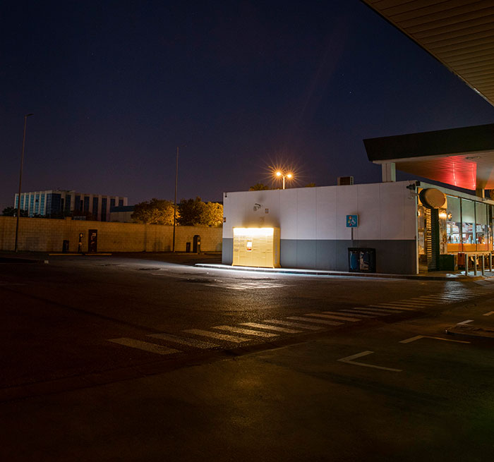 Dimly lit gas station at night, evoking a sense of fear and tension related to kidnapping experiences.