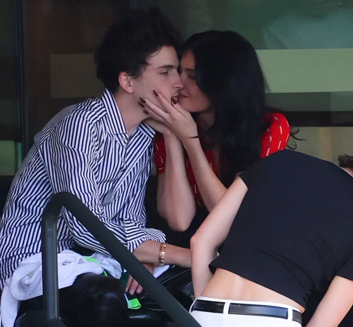 Kylie Jenner and Timoth&eacute;e Chalamet sharing an intimate moment outdoors, highlighting Kylie Jenner's racy posts after a birthday snub.