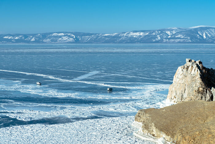 Uaz Vans Crossing The Frozen Expanse Of Lake Baikal