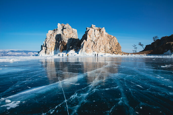 Shaman Rock Reflected On The Frozen Surface Of Lake Baikal