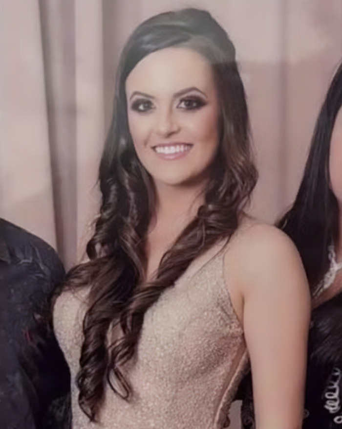 Young woman smiling at a formal event, representing a 22-year-old law graduate who passed away after routine CT scan.