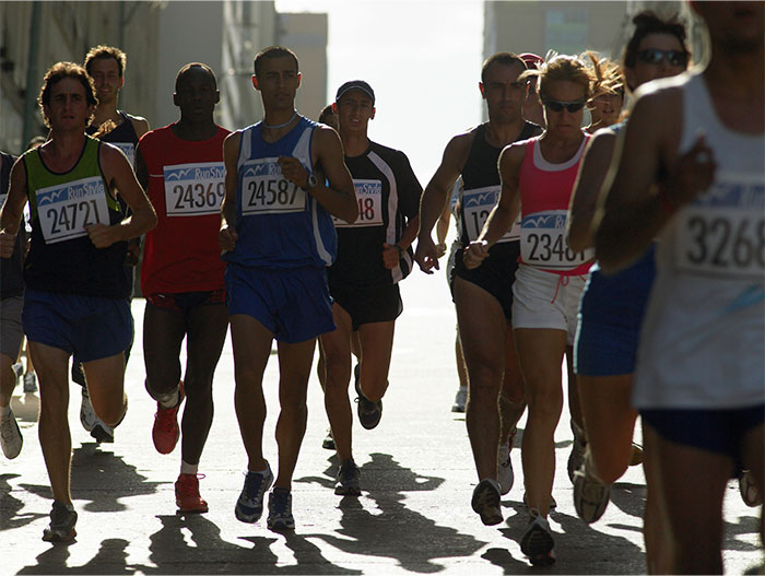 Runners competing in the Boston Marathon, showcasing endurance and determination during the race event. - 9
