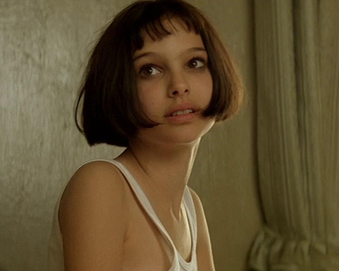 Young woman with short hair and natural makeup showcasing the new tired girl beauty trend popular among Gen Z women.