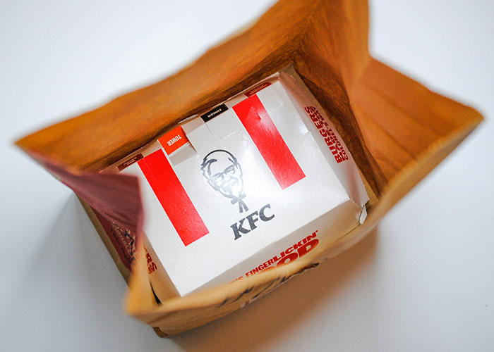 KFC meal box inside a paper bag illustrating people accidentally discovering loopholes they used to their advantage.