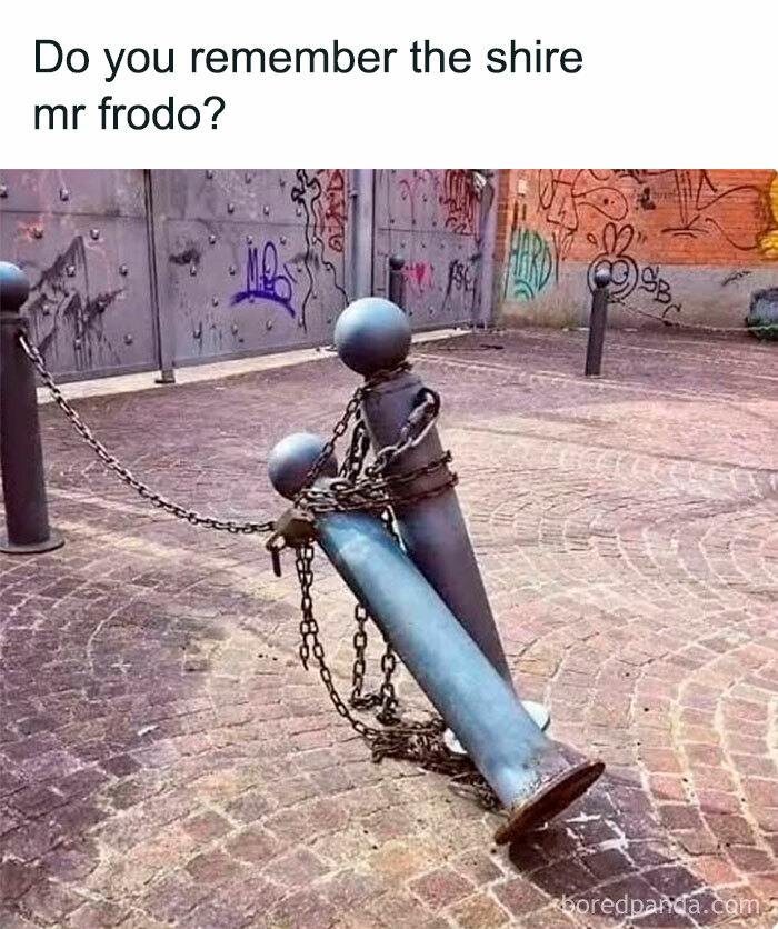 Metal bollards chained and leaning, resembling two figures, with graffiti background, related to Lord of the Rings memes.