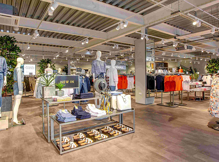 Clothing store interior with mannequins and new arrivals, related to alleged trans employee story and J.K. Rowling.