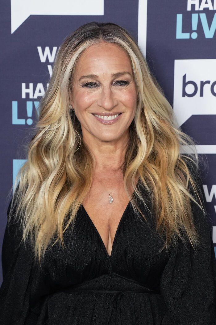 Blonde woman smiling at event, with long wavy hair and black dress, highlighting Maxim most unattractive women list backlash. Blonde woman smiling at event, with long wavy hair and black dress, highlighting Maxim most unattractive women list backlash.
