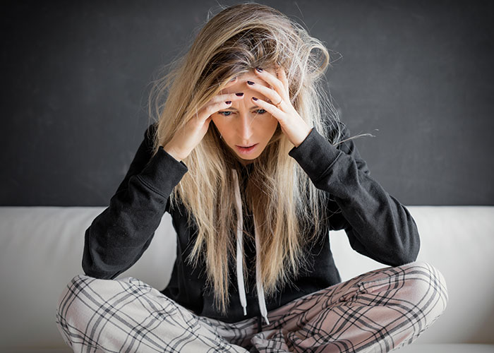 Young woman in casual clothes looking distressed, illustrating times doctors got it wrong and patients suffered.