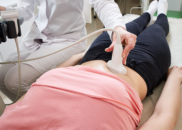 Doctor performing an ultrasound on a young patient illustrating times doctors got it wrong in diagnosis.