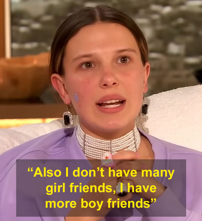 Millie Bobby Brown wearing earrings and choker, discussing friendships in a resurfaced interview after adopting a baby at 21.