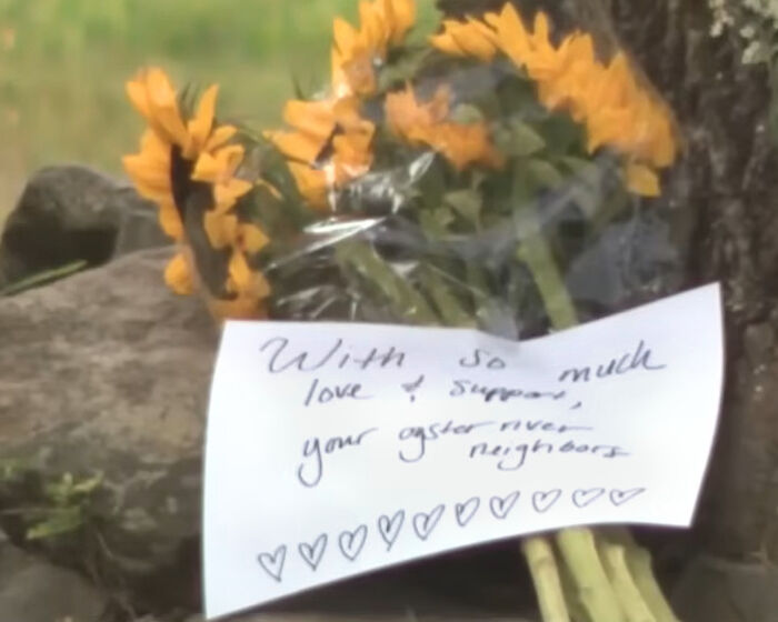 Bouquet of sunflowers with a handwritten note left at a memorial site for a depressed mom and her perfect family.