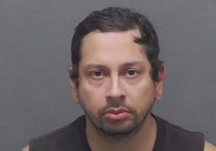 Mugshot of a man accused in a case involving a mom allegedly helping 13-year-old son plan a mass school shooting. - 7