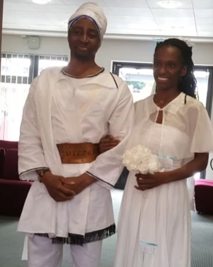 Woman breaking silence on crucial signs ignored after toddler passed away due to vegan diet, standing beside a man in traditional attire.