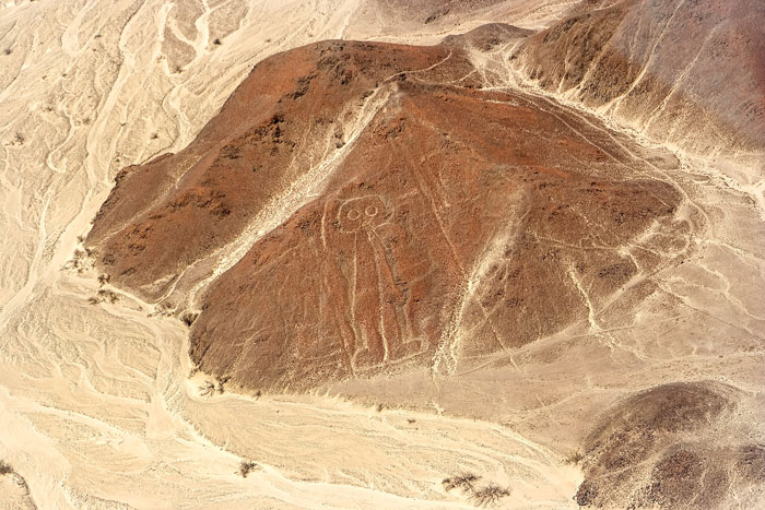 Aerial view of a geoglyph discovered using AI technology, showcasing one of the biggest historical puzzles in the desert.